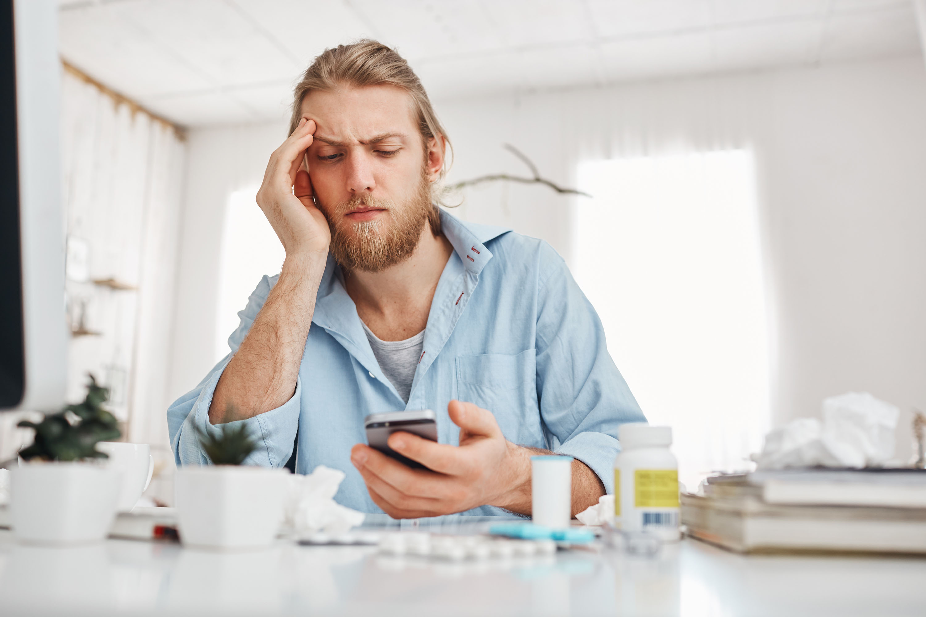 A candidate feeling under the weather sitting in front of his computer.