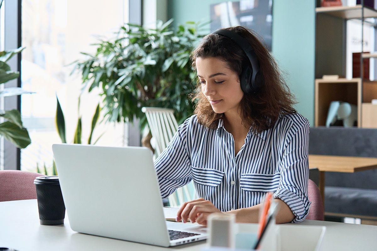 A candidate sitting in front of a computer taking an exam.